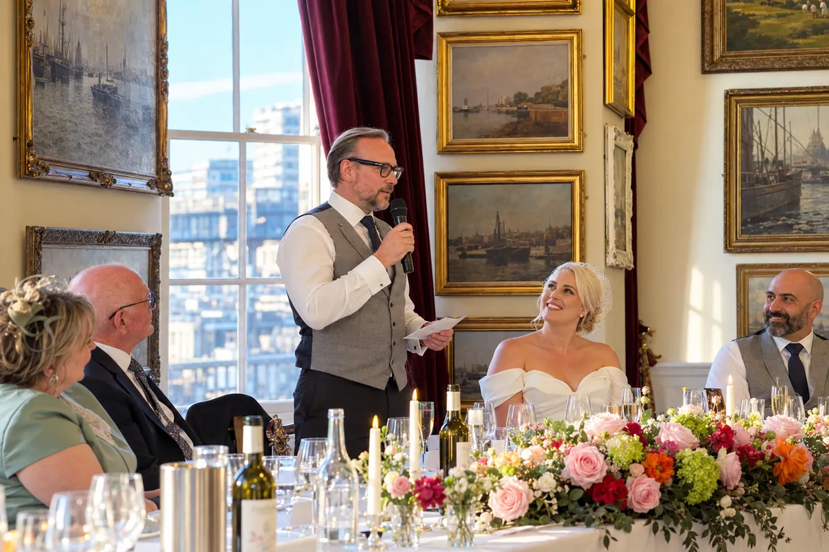 Wireless Microphone for Wedding Speeches Groom giving his wedding speech with a wireless microphone as the bride looks on